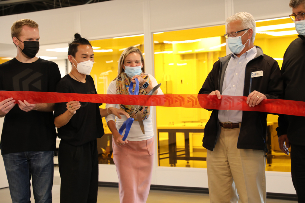 Mayor Breanna Lungo-Koehn cutting a ceremonial ribbon made by OPT’s 3D printing system.